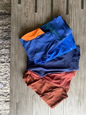 Bundle of blue and rust brown leggings